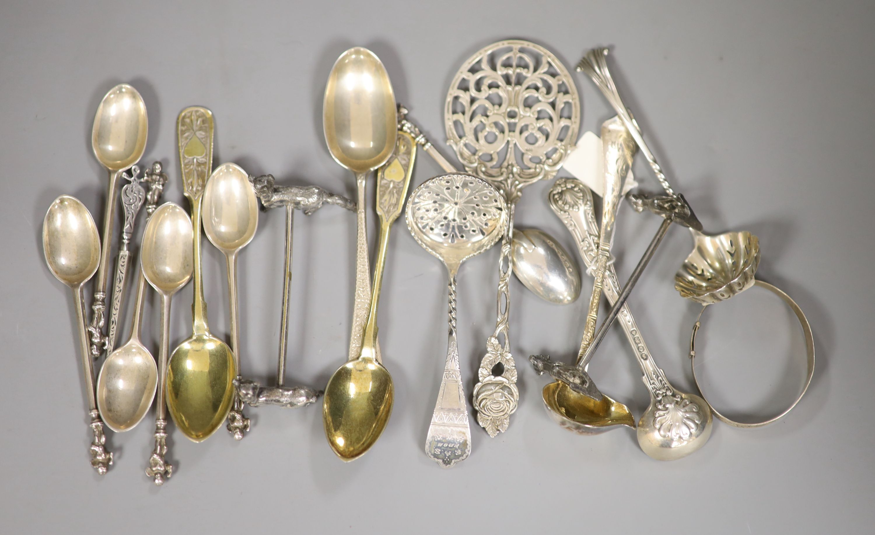 A set of six Victorian silver cupid finial coffee spoons and sundry decorative spoons including two Russian, 8oz.